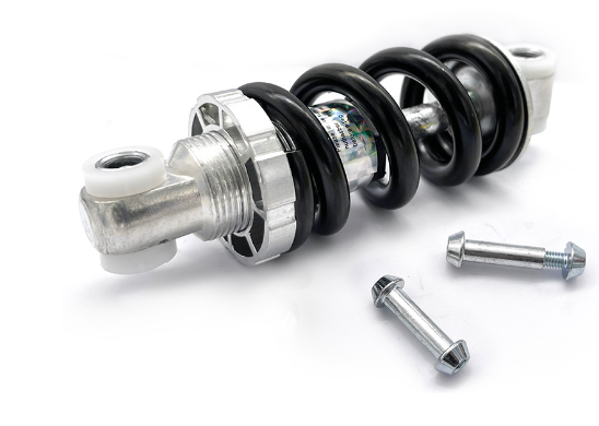 Amortisseur arrière à ressort noir et argent de 125 mm avec ses vis de fixation sur fond blanc
