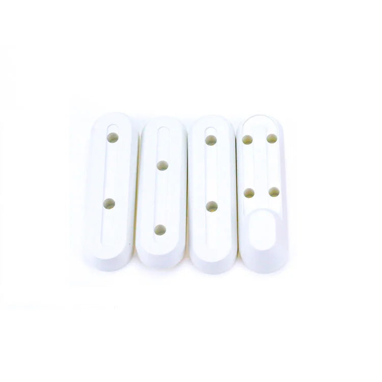 Quatre caches de protection en plastique blanc pour trottinette électrique