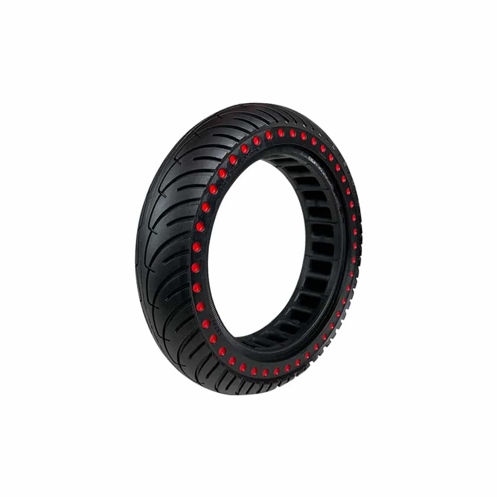 Pneu plein noir 8.5x2 perforé de trous alvéolés rouges vu de trois-quarts