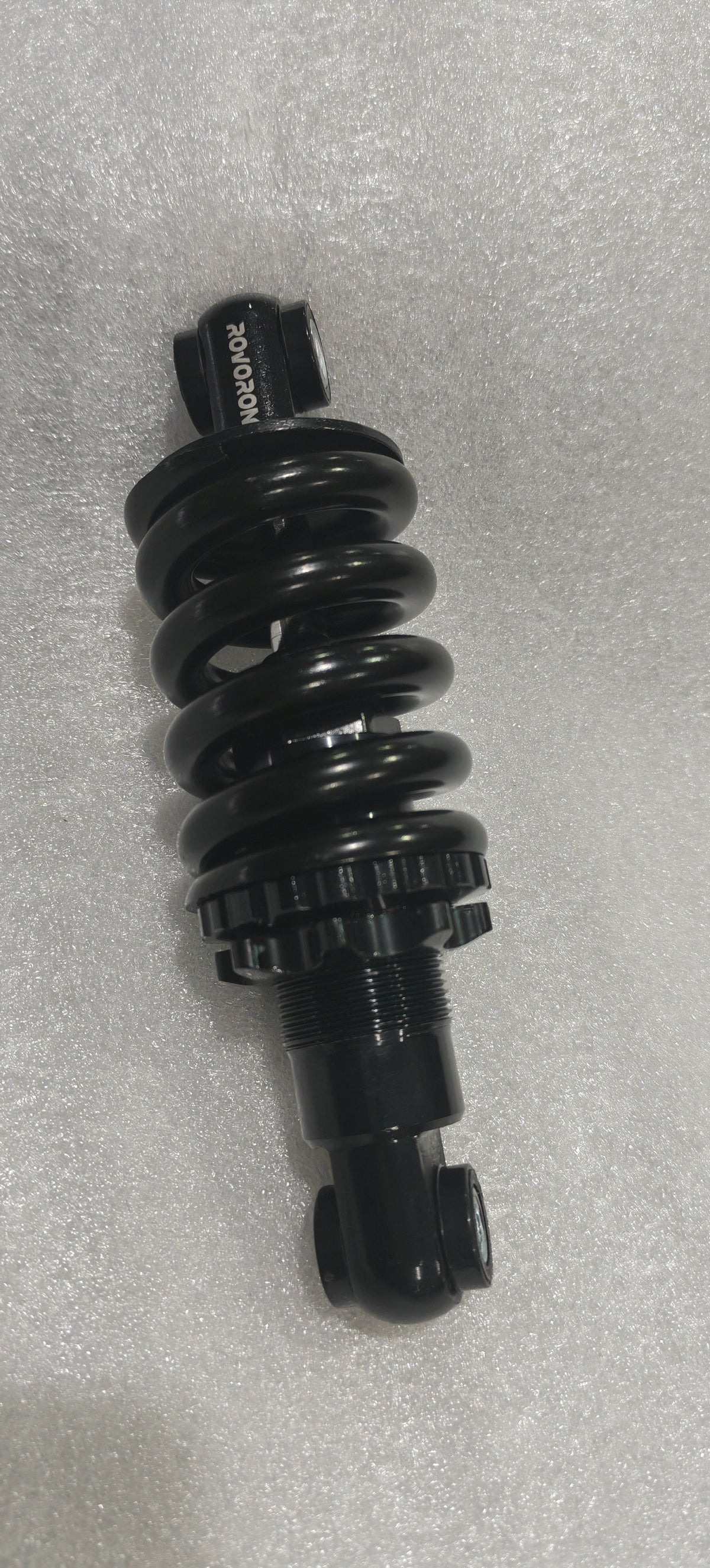Suspension arrière noire à ressort pour trottinette électrique Rovoron R7
